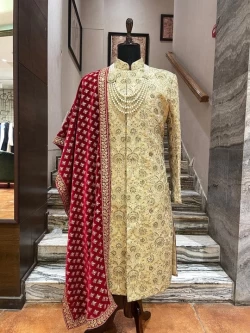 Golden sherwani with maroon velvet stole